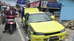 Potret Mobil Terjun ke Kolam-Sawah Usai Ditabrak Truk Rem Blong