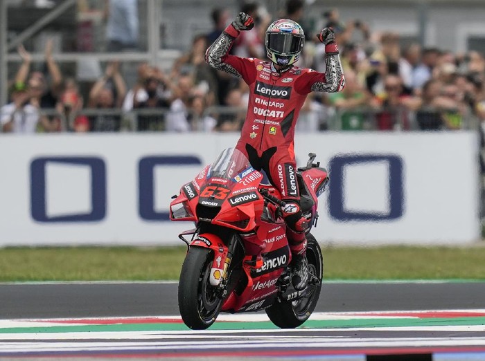 Italys Francesco Bagnaia rides his Ducati as he celebrates winning the San Marino MotoGP race, at the Misano circuit in Misano Adriatico, Italy, Sunday, Sept. 19, 2021. (AP Photo/Antonio Calanni)