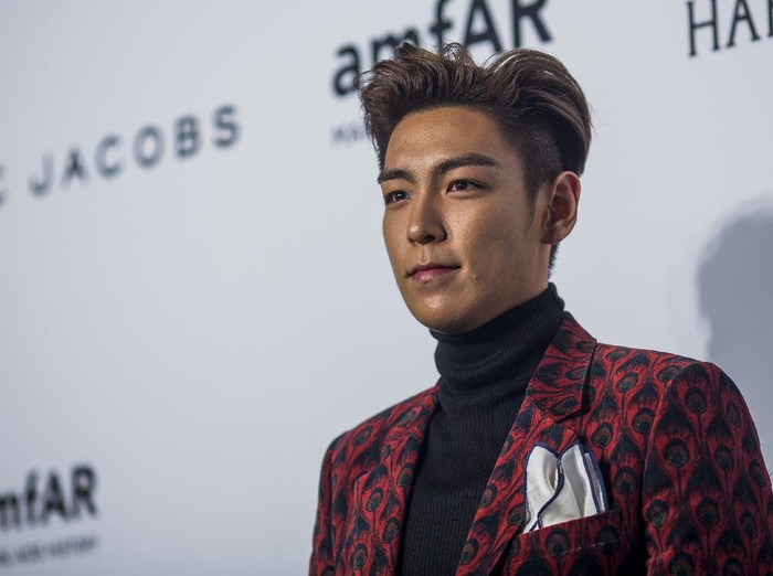 HONG KONG - MARCH 14:  Singer T.O.P arrives on the red carpet during the 2015 amfAR Hong Kong gala at Shaw Studios on March 14, 2015 in Hong Kong.  (Photo by Jerome Favre/Getty Images)