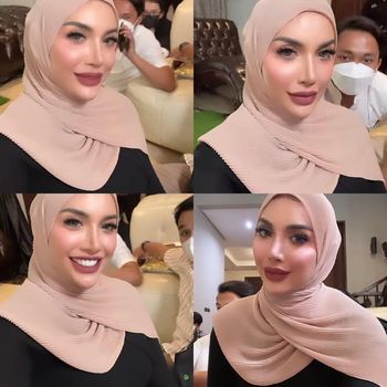 Gaya Millen Cyrus yang memakai hijab.