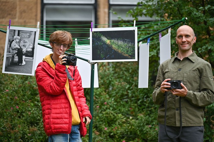 Lockdown Berbuah Pameran Fotografi GLASGOW, SCOTLAND - SEPTEMBER 17: Brian Hartley and Dylan Lombard (R) pose beside their photographic exhibition in a tenement garden on September 17, 2021 in Glasgow, Scotland. “Stills of a Lockdown City” features images taken during the 2020 coronavirus lockdown by Glasgow-based artist Brian Hartley and 18-year-old Dylan Lombard, and aims to offer “a perspective that allows us to make more sense of the world”. It will take place on September 18 and 19, 2021. (Photo by Jeff J Mitchell/Getty Images)