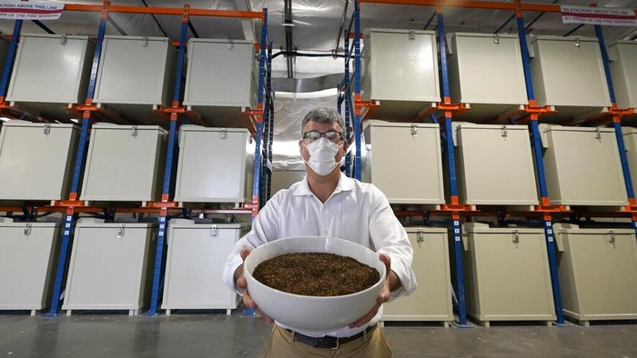 A container of compost produced from human remains is shown at Recompose, a company that composts human remains into soil, Wednesday, Sept. 15, 2021, in Kent, Wash., south of Seattle. Earlier in September, Colorado became the second state after Washington to allow human body composting, and Oregon will allow the practice beginning next July. (AP Photo/Ted S. Warren)