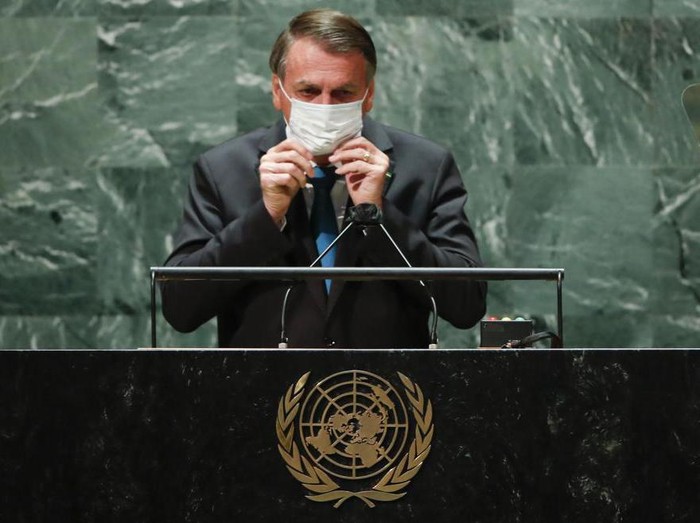 Brazils President Jair Bolsonaro puts back on a protective face mask after speaking during the 76th Session of the United Nations General Assembly at U.N. headquarters in New York on Tuesday, Sept. 21, 2021. (Eduardo Munoz/Pool Photo via AP)