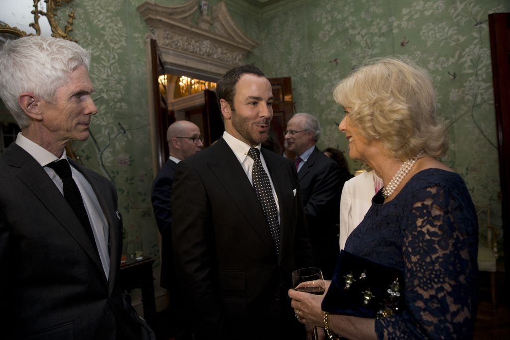 LONDON, ENGLAND - MARCH 9:  Camilla, Duchess of Cornwall, meets U.S. fashion designer Tom Ford, center, and his husband, writer and journalist, Richard Buckley, during a reception for Americans living and working in the UK, at the official residence of the U.S. Ambassador to Britain, Winfield House on March 9, 2015 in London, United Kingdom. The reception was held Monday evening ahead of Prince Charles and his wife Camilla visiting the U.S. next week. (Photo by Matt Dunham - WPA Pool/Getty Images)