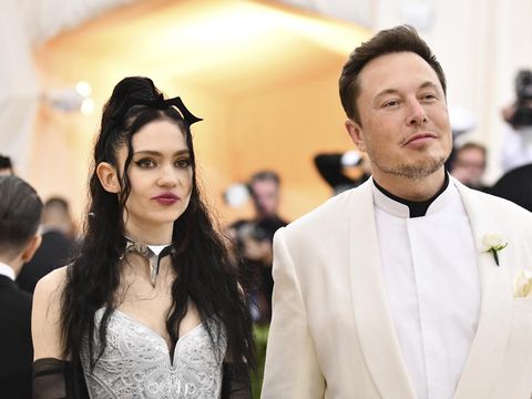 FILE - Grimes, left, and Elon Musk attend The Metropolitan Museum of Art's Costume Institute benefit gala in New York on May 7, 2018. The Tesla and SpaceX founder tells the New York Post that he and the Canadian singer are 