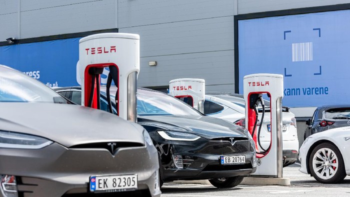 Lyngdal, Norway - August 02 2021: Tesla Superchargers at use at Handelsparken.