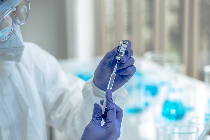 Scientists are done research on vaccine in laboratory with test tubes on Covid19 Coronavirus type for discover vaccine.