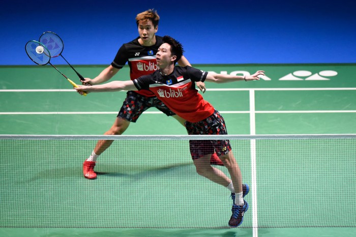 CHOFU, JAPAN - JULY 28: Marcus Fernaldi Gideon and Kevin Sanjaya Sukamuljo of Indonesia compete in the Mens Doubles Final match against Mohammad Ahsan and Hendra Setiawan of Indonesia on day six of the Daihatsu Yonex Japan Open Badminton Championships, Tokyo 2020 Olympic Games test event at Musashino Forest Sport Plaza on July 28, 2019 in Chofu, Tokyo, Japan. (Photo by Matt Roberts/Getty Images)
