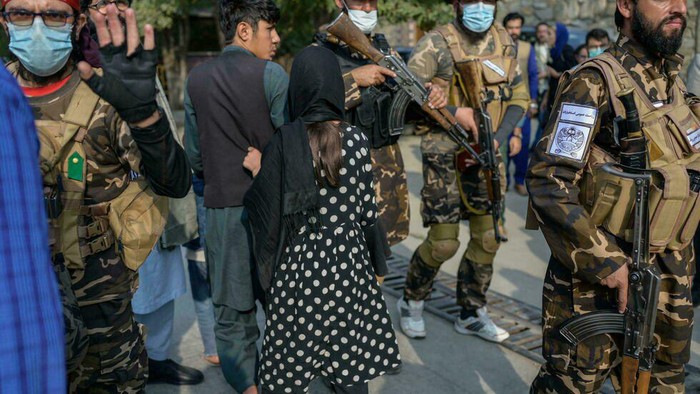 The Taliban pushed back women protesters as they tried to continue with the small demonstration in Kabul, while a foreign journalist was hit with a rifle and blocked from filming (BULENT KILIC/AFP)