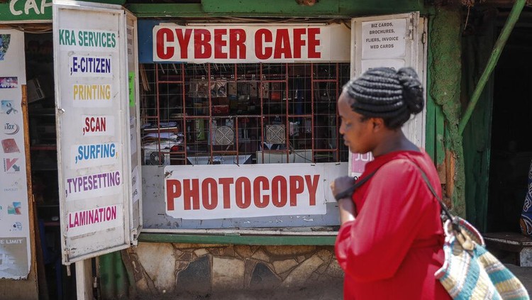 Two young boys use a computer at an internet cafe in the low-income Kibera neighborhood of Nairobi, Kenya Wednesday, Sept. 29, 2021. Instead of serving Africas internet development, millions of internet addresses reserved for Africa have been waylaid, some fraudulently, including in insider machinations linked to a former top employee of the nonprofit that assigns the continents addresses. (AP Photo/Brian Inganga)