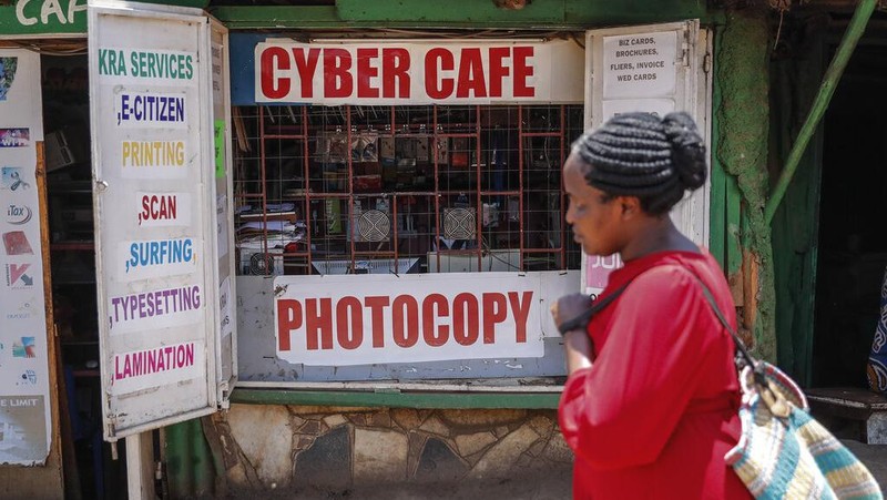 Two young boys use a computer at an internet cafe in the low-income Kibera neighborhood of Nairobi, Kenya Wednesday, Sept. 29, 2021. Instead of serving Africa's internet development, millions of internet addresses reserved for Africa have been waylaid, some fraudulently, including in insider machinations linked to a former top employee of the nonprofit that assigns the continent's addresses. (AP Photo/Brian Inganga)