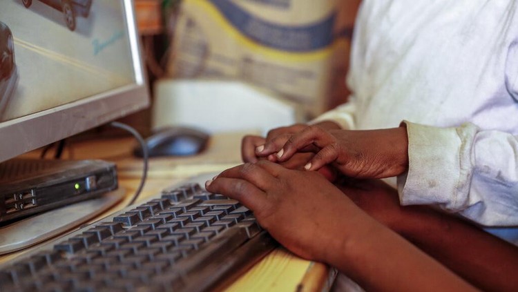 Two young boys use a computer at an internet cafe in the low-income Kibera neighborhood of Nairobi, Kenya Wednesday, Sept. 29, 2021. Instead of serving Africas internet development, millions of internet addresses reserved for Africa have been waylaid, some fraudulently, including in insider machinations linked to a former top employee of the nonprofit that assigns the continents addresses. (AP Photo/Brian Inganga)
