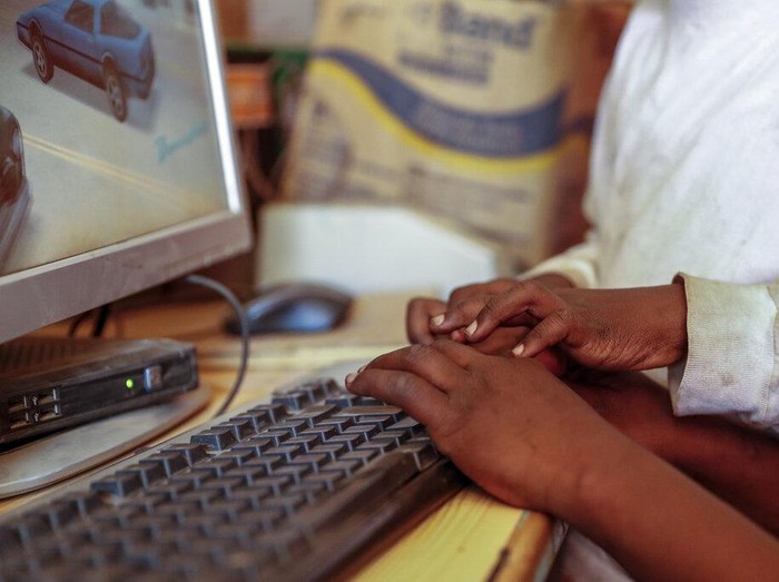 Two young boys use a computer at an internet cafe in the low-income Kibera neighborhood of Nairobi, Kenya Wednesday, Sept. 29, 2021. Instead of serving Africas internet development, millions of internet addresses reserved for Africa have been waylaid, some fraudulently, including in insider machinations linked to a former top employee of the nonprofit that assigns the continents addresses. (AP Photo/Brian Inganga)