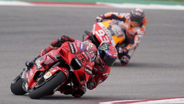 Francesco Bagnaia (63), of Italy, and Marc Marquez (93), of Spain, steer through a turn during an open practice session for the MotoGP Grand Prix of the Americas race at the Circuit of the Americas, Saturday, Oct. 2, 2021, in Austin, Texas. (AP Photo/Eric Gay)