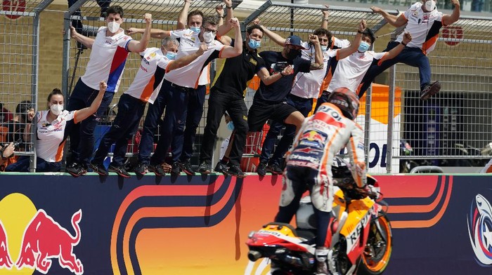 Spains Marc Marquez (93) is cheered by his crew as he wins the MotoGP Grand Prix of the Americas motorcycle race at Circuit of the Americas, Sunday, Oct. 3, 2021, in Austin, Texas. (AP Photo/Eric Gay)
