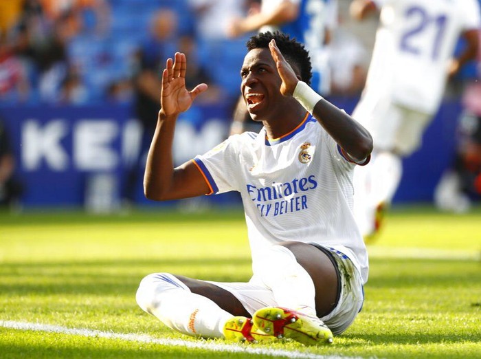 Real Madrid's Vinicius Junior reacts during a Spanish La Liga soccer match between RCD Espanyol and Real Madrid at the Cornella-El Prat stadium in Barcelona, Spain, Sunday, Oct. 3, 2021. (AP Photo/Joan Monfort)