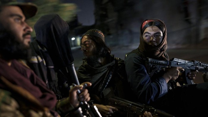 A combo image shows portraits of Taliban fighters taken at various police stations in Kabul, Afghanistan, from Sept. 16 to 22, 2021. (AP Photo/Felipe Dana)