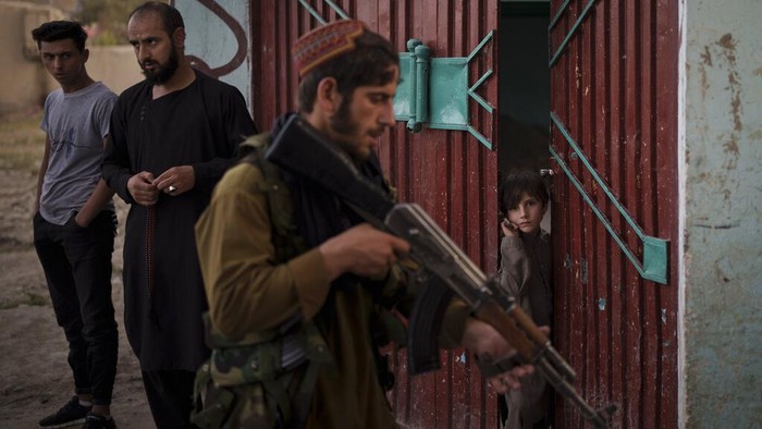 A combo image shows portraits of Taliban fighters taken at various police stations in Kabul, Afghanistan, from Sept. 16 to 22, 2021. (AP Photo/Felipe Dana)