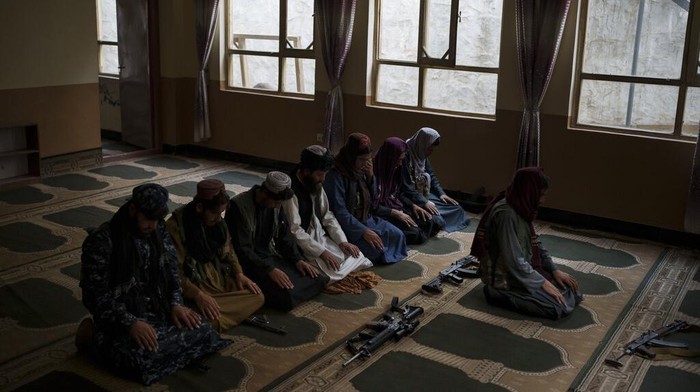 A combo image shows portraits of Taliban fighters taken at various police stations in Kabul, Afghanistan, from Sept. 16 to 22, 2021. (AP Photo/Felipe Dana)