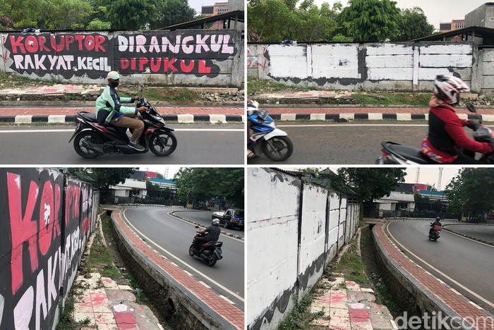 Selang Sehari, Mural 'Koruptor Dirangkul' Langsung Dihapus Pengendara melintas di depan mural 'Koruptor Dirangkul' yang sudah dihapus, di Bintaro, Pesanggrahan, Jakarta Selatan, Rabu (6/10). Mural ini masih terlihat pada Senin (4/10).