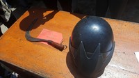 Polisi juga mengamankan barang bukti helm dan celurit.