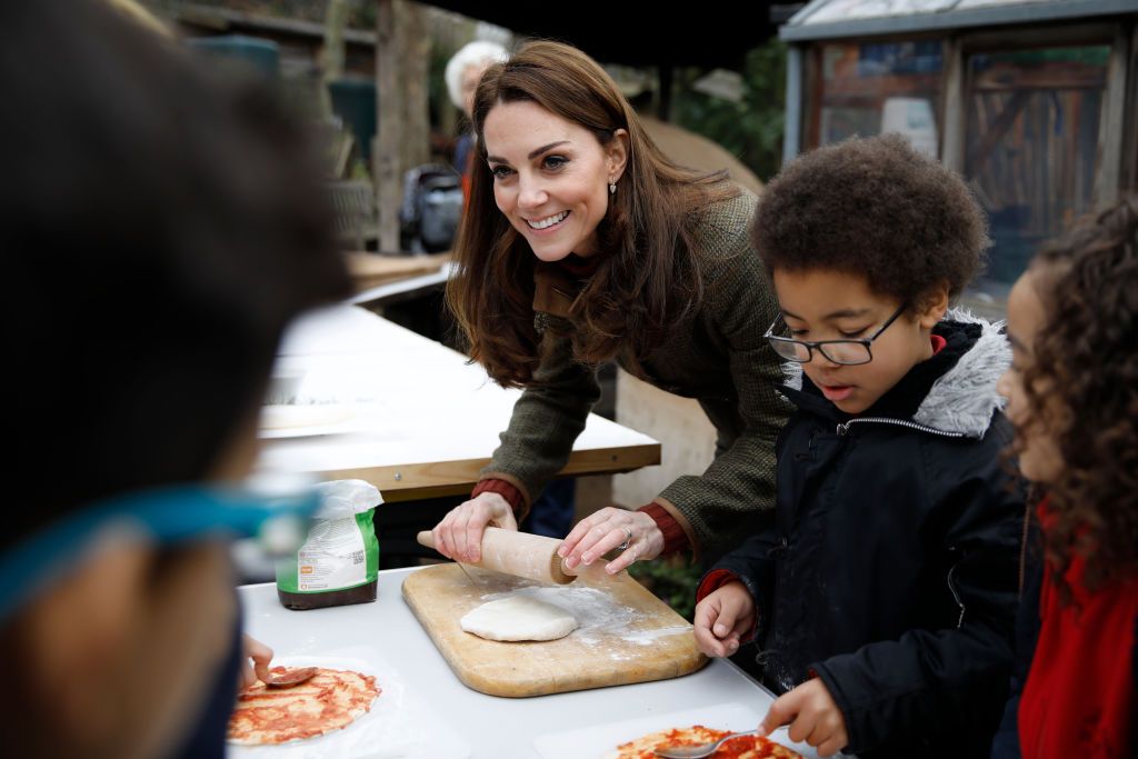LONDON, ENGLAND - JANUARY 15:  Catherine, Duchess of Cambridge speaks with children and helps makes pizza as she visits Islington Community Garden on January 15, 2019 in London, England. (Photo by Tolga Akmen - WPA Pool/Getty Images)