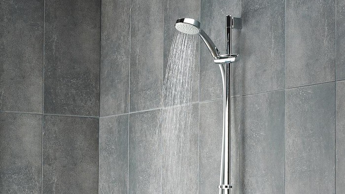 Shot of running water from shower head in a bathroom