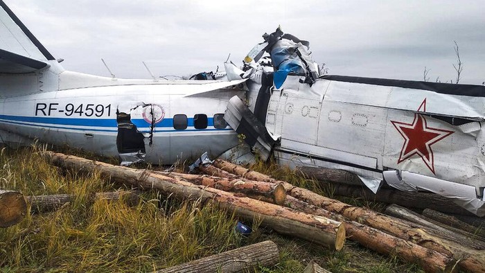 This photo provided by the Russian Emergency Situations Ministry press service shows the L-410, a Czech-made twin-engine turboprop, crashed near the town of Menzelinsk, about 960 kilometers (600 miles) east of Moscow, Russia, Sunday, Oct. 10, 2021. A plane carrying skydivers crashed Sunday shortly after takeoff in central Russia, reportedly killing 15 of the 22 people aboard. The L-410, a Czech-made twin-engine turboprop, crashed near Menzelinsk, about 960 kilometers (600 miles) east of Moscow (Ministry of Emergency Situations press service via AP)