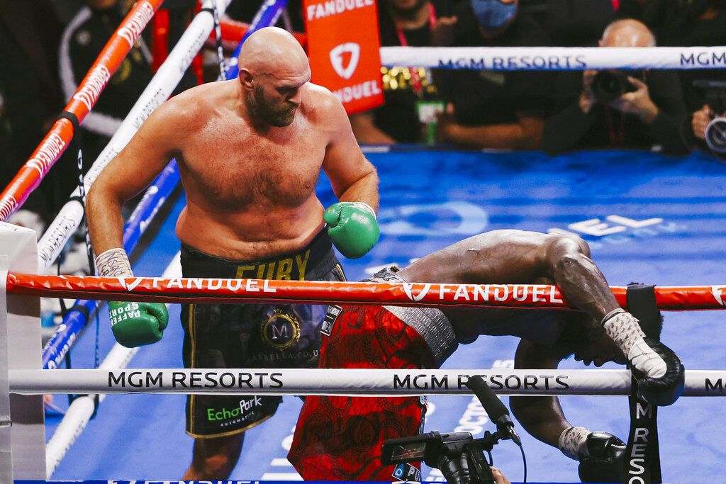 Tyson Fury knocks out Deontay Wilder during their WBC Heavyweight World Championship fight at T-Mobile Arena in Las Vegas, Saturday, Oct. 9, 2021. (Wade Vandervort/Las Vegas Sun via AP)