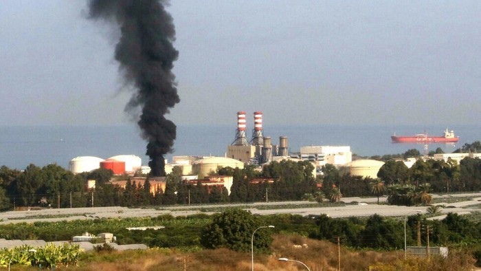 Smoke billows from a huge fire in a storage tank at the Zahrani fuel facility in southern Lebanon on Monday (Mahmoud ZAYYAT/AFP)