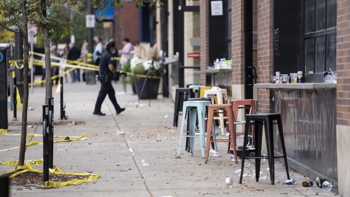 Investigators processed the chaotic scene of a multiple shooting at the bar Truck Park in St. Paul, Minn., that happened after midnight on Sunday, Oct. 10, 2021. (Renee Jones Schneider/Star Tribune via AP)