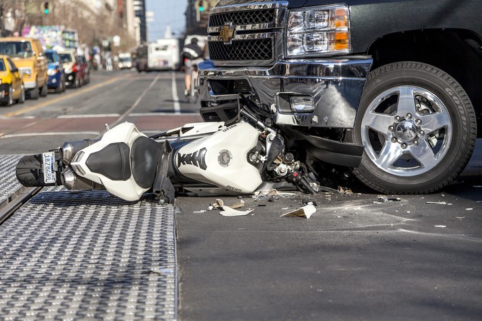 San Francisco, USA - January 23, 2014: A bad traffic accident between a white Ducati motorcycle and Chevy pickup truck occurred on Market street in the late afternoon and brought traffic to a halt, backing up Muni buses and light rain trains. No fatalities were reported.