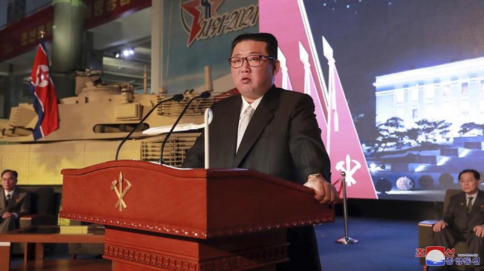 In this photo provided by the North Korean government, North Korean leader Kim Jong Un speaks during an exhibition of weapons systems in Pyongyang, North Korea, Monday, Oct. 11, 2021. Kim reviewed the rare exhibition and vowed to build an “invincible” military, as he accused the United States of creating regional tensions and lacking action to prove it has no hostile intent toward the North, state media reported Tuesday. Independent journalists were not given access to cover the event depicted in this image distributed by the North Korean government. The content of this image is as provided and cannot be independently verified. Korean language watermark on image as provided by source reads: 