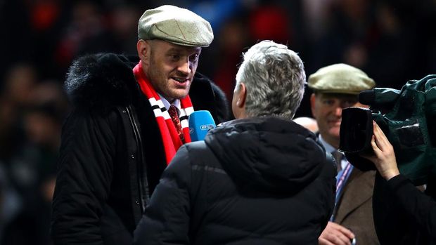 MANCHESTER, ENGLAND - DECEMBER 05:  Boxer Tyson Fury is interviewed during half time during the Premier League match between Manchester United and Arsenal FC at Old Trafford on December 5, 2018 in Manchester, United Kingdom.  (Photo by Clive Brunskill/Getty Images)