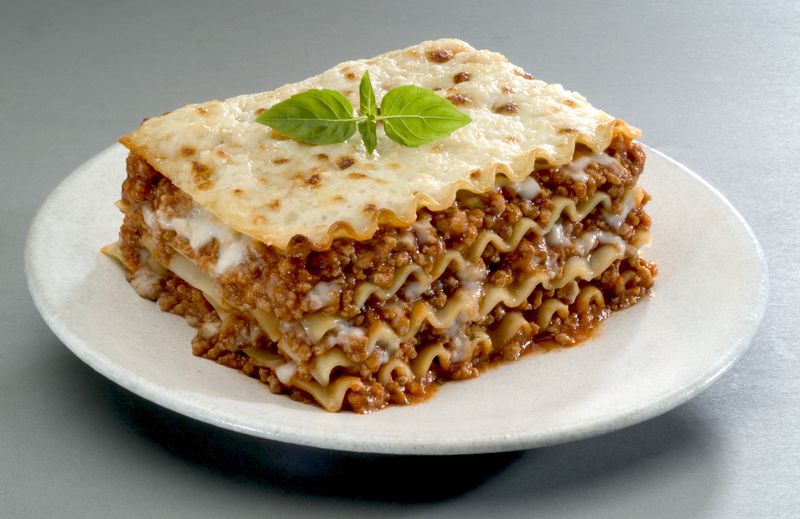 Traditional Italian pasta, lasagna is made with minced beef bolognese sauce with tomato, basil, and Mozzarella cheese.