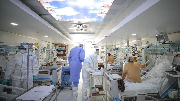 Patients lie on beds in the emergency room, turned into a CODIV-19 unit due to the high number of cases, at the Bagdasar-Arseni hospital in Bucharest, Romania, Tuesday, Oct. 12, 2021. (AP Photo/Andreea Alexandru)