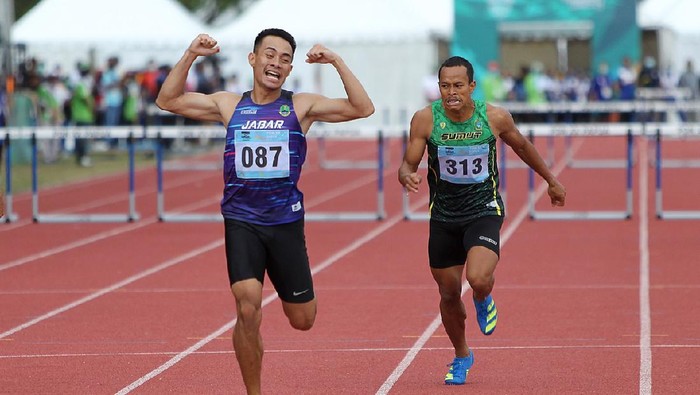 Atlet Jawa Barat, Halomoan EB (087) berhasil meraih medali emas Atletik PON XX Papua nomor Lari 400m Gawang Putra. (Foto : PB PON XX Papua/Ady Sesotya)