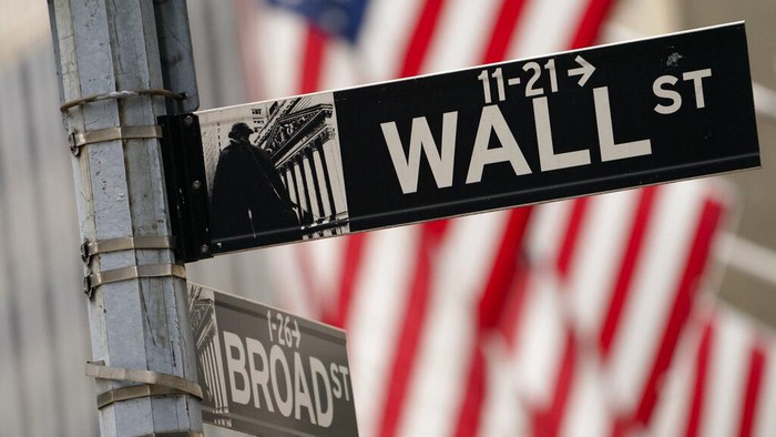 FILE - A Wall Street sign is seen next to surveillance equipment outside the New York Stock Exchange, Tuesday, Oct. 5, 2021, in New York.  Stocks are edging higher in early trading on Wall Street Tuesday, Oct. 12,  as traders wait for more data on inflation and corporate earnings this week.    (AP Photo/Mary Altaffer)