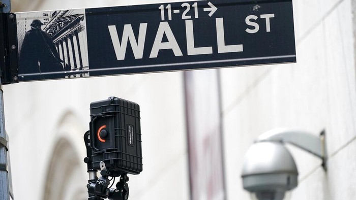 FILE - A Wall Street sign is seen next to surveillance equipment outside the New York Stock Exchange, Tuesday, Oct. 5, 2021, in New York.  Stocks are edging higher in early trading on Wall Street Tuesday, Oct. 12,  as traders wait for more data on inflation and corporate earnings this week.    (AP Photo/Mary Altaffer)
