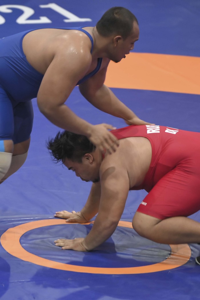 Pegulat Papang Ramadhani mempersembahkan medali emas untuk Kalimantan Timur. Papang mampu mengalahkan semua lawannya di duel 130kg gaya greco PON XX Papua.