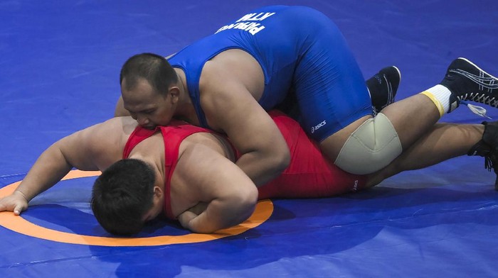 Melihat Kuncian Pegulat Papang Ramadhani yang Berujung Emas Pegulat Papang Ramadhani mempersembahkan medali emas untuk Kalimantan Timur. Papang mampu mengalahkan semua lawannya di duel 130kg gaya greco PON XX Papua.