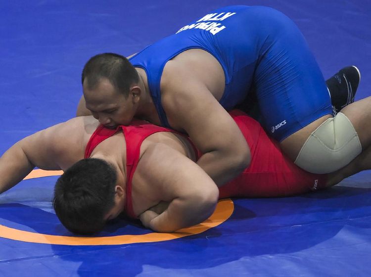 Melihat Kuncian Pegulat Papang Ramadhani yang Berujung Emas