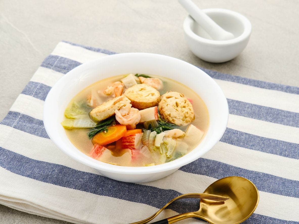 Sapo tahu, chinese food made with tofu, vegetables and seafood. Served on white bowl.