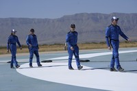 Audrey Powers, left, speaks as William Shatner, from left, Chris Boshuizen and Glen de Vries look on during a media availability at the Blue Origin spaceport near Van Horn, Texas, Wednesday, Oct. 13, 2021.  The “Star Trek” actor and the three fellow passengers hurtled to an altitude of 66.5 miles (107 kilometers) over the West Texas desert in the fully automated capsule, then safely parachuted back to Earth in a flight that lasted just over 10 minutes. (AP Photo/LM Otero)