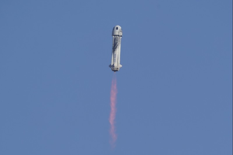Audrey Powers, left, speaks as William Shatner, from left, Chris Boshuizen and Glen de Vries look on during a media availability at the Blue Origin spaceport near Van Horn, Texas, Wednesday, Oct. 13, 2021.  The “Star Trek” actor and the three fellow passengers hurtled to an altitude of 66.5 miles (107 kilometers) over the West Texas desert in the fully automated capsule, then safely parachuted back to Earth in a flight that lasted just over 10 minutes. (AP Photo/LM Otero)