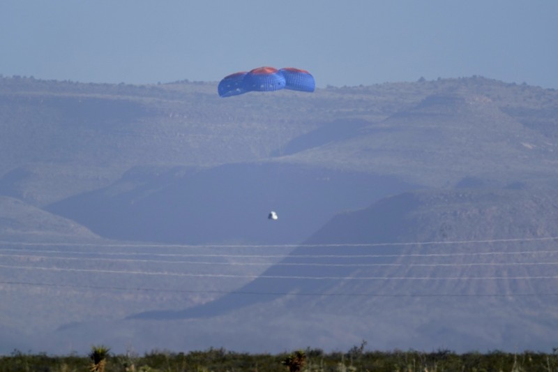 Audrey Powers, left, speaks as William Shatner, from left, Chris Boshuizen and Glen de Vries look on during a media availability at the Blue Origin spaceport near Van Horn, Texas, Wednesday, Oct. 13, 2021.  The “Star Trek” actor and the three fellow passengers hurtled to an altitude of 66.5 miles (107 kilometers) over the West Texas desert in the fully automated capsule, then safely parachuted back to Earth in a flight that lasted just over 10 minutes. (AP Photo/LM Otero)