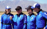 Audrey Powers, left, speaks as William Shatner, from left, Chris Boshuizen and Glen de Vries look on during a media availability at the Blue Origin spaceport near Van Horn, Texas, Wednesday, Oct. 13, 2021.  The “Star Trek” actor and the three fellow passengers hurtled to an altitude of 66.5 miles (107 kilometers) over the West Texas desert in the fully automated capsule, then safely parachuted back to Earth in a flight that lasted just over 10 minutes. (AP Photo/LM Otero)