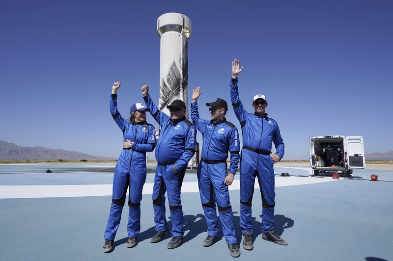 Audrey Powers, left, speaks as William Shatner, from left, Chris Boshuizen and Glen de Vries look on during a media availability at the Blue Origin spaceport near Van Horn, Texas, Wednesday, Oct. 13, 2021.  The “Star Trek” actor and the three fellow passengers hurtled to an altitude of 66.5 miles (107 kilometers) over the West Texas desert in the fully automated capsule, then safely parachuted back to Earth in a flight that lasted just over 10 minutes. (AP Photo/LM Otero)