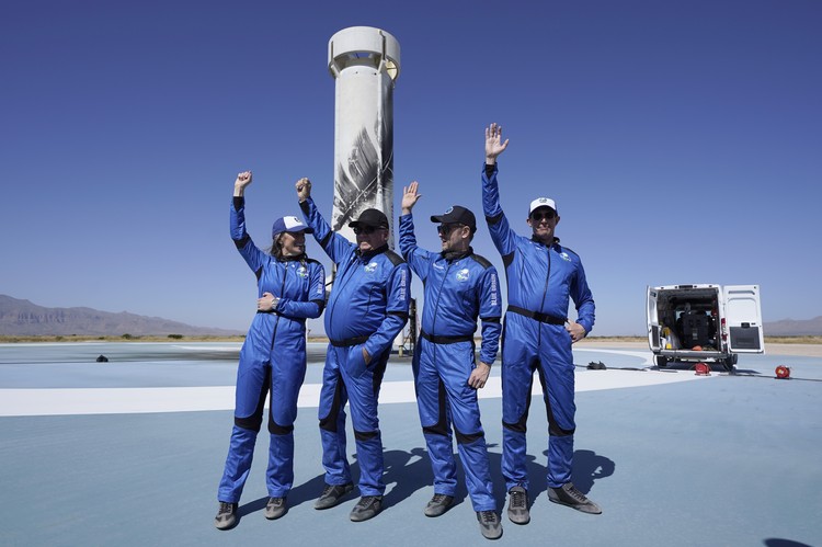 Audrey Powers, left, speaks as William Shatner, from left, Chris Boshuizen and Glen de Vries look on during a media availability at the Blue Origin spaceport near Van Horn, Texas, Wednesday, Oct. 13, 2021.  The “Star Trek” actor and the three fellow passengers hurtled to an altitude of 66.5 miles (107 kilometers) over the West Texas desert in the fully automated capsule, then safely parachuted back to Earth in a flight that lasted just over 10 minutes. (AP Photo/LM Otero)