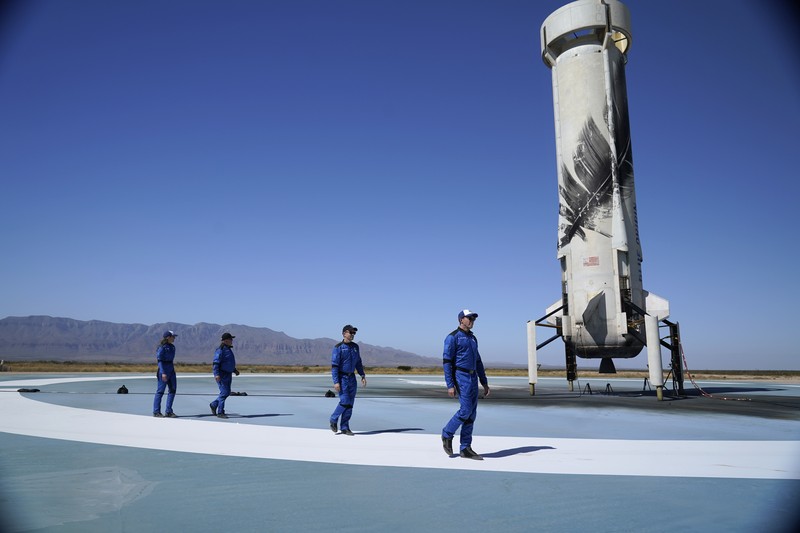Audrey Powers, left, speaks as William Shatner, from left, Chris Boshuizen and Glen de Vries look on during a media availability at the Blue Origin spaceport near Van Horn, Texas, Wednesday, Oct. 13, 2021.  The “Star Trek” actor and the three fellow passengers hurtled to an altitude of 66.5 miles (107 kilometers) over the West Texas desert in the fully automated capsule, then safely parachuted back to Earth in a flight that lasted just over 10 minutes. (AP Photo/LM Otero)